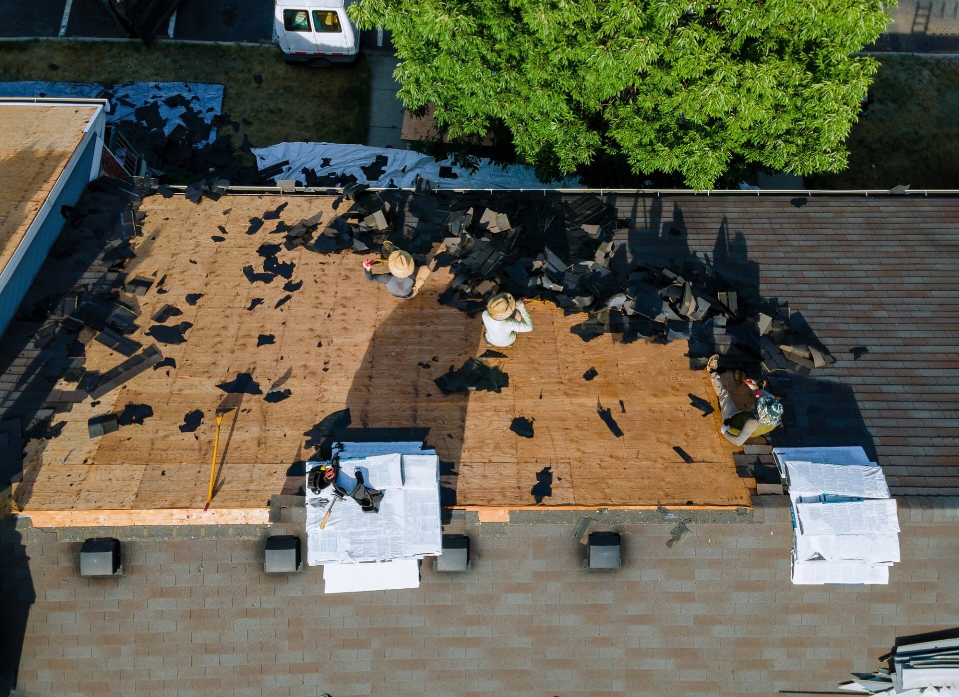 Roofing crew working on a residential roofing installation