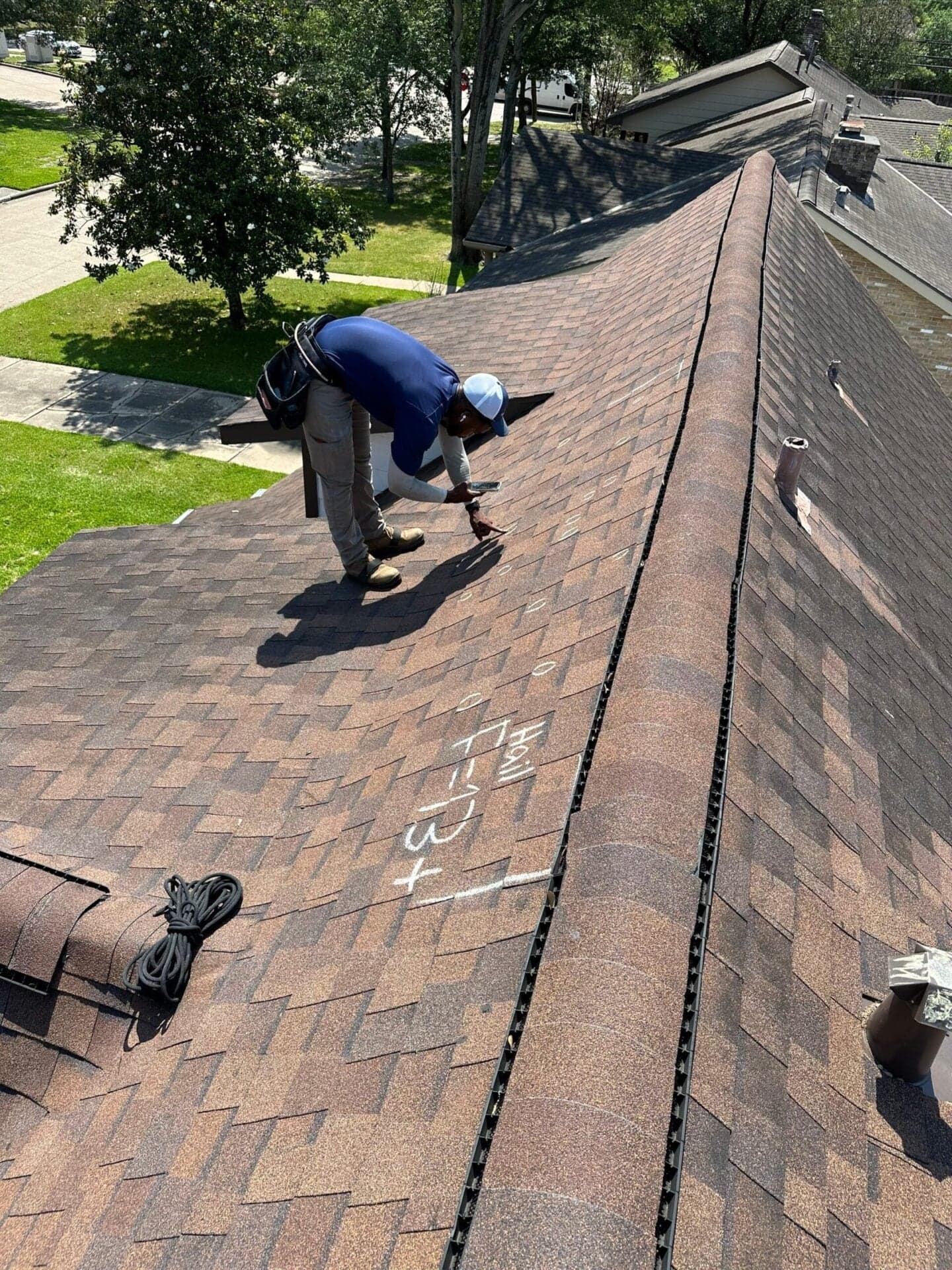 Residential roof being inspected after a Utah storm